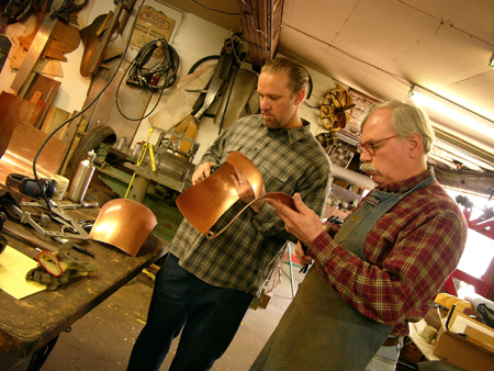 Jesse James and Fay Butler making a copper tank